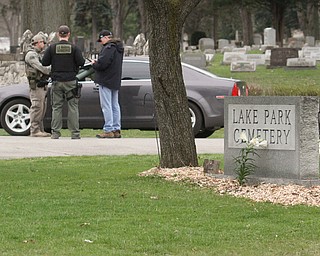      ROBERT K. YOSAY  | THE VINDICATOR..The search for Luis Cruz Ramos  led by the U.S. Marshals Service, which was among the agencies staked out at Lake Park Cemetery on Midlothian Boulevard until about 10 a.m. today. -..--30-.....