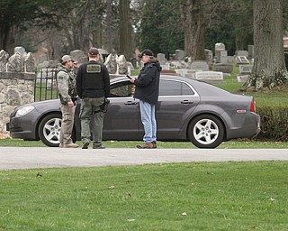      ROBERT K. YOSAY  | THE VINDICATOR..The search for Luis Cruz Ramos  led by the U.S. Marshals Service, which was among the agencies staked out at Lake Park Cemetery on Midlothian Boulevard until about 10 a.m. today. -..--30-.....