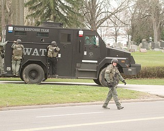     ROBERT K. YOSAY  | THE VINDICATOR..The search for Luis Cruz Ramos  led by the U.S. Marshals Service, which was among the agencies staked out at Lake Park Cemetery on Midlothian Boulevard until about 10 a.m. today. -..--30-.....