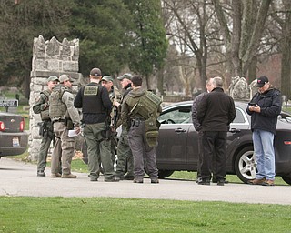      ROBERT K. YOSAY  | THE VINDICATOR..The search for Luis Cruz Ramos  led by the U.S. Marshals Service, which was among the agencies staked out at Lake Park Cemetery on Midlothian Boulevard until about 10 a.m. today. -..--30-.....
