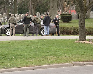      ROBERT K. YOSAY  | THE VINDICATOR..The search for Luis Cruz Ramos  led by the U.S. Marshals Service, which was among the agencies staked out at Lake Park Cemetery on Midlothian Boulevard until about 10 a.m. today. -..--30-.....