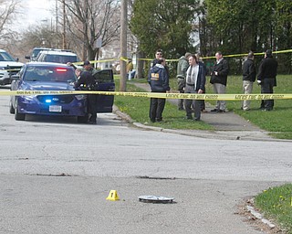      ROBERT K. YOSAY  | THE VINDICATOR..YPD officers look for evidence on Maywood and Erie.."Members of the US Marshals Northern Ohio Violent Fugitive Task Force were actively searching for Luis R Cruz-Ramos," said Capt. Brad Blackburn in the news release. "He was spotted walking near the 200 block of Lowell Avenue. He fled toward Maywood, holding a handgun as the task force attempted to apprehend him." - .--30-...