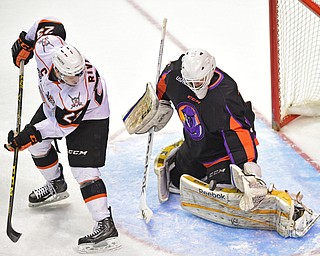 YOUNGSTOWN, OHIO - APRIL 1, 2016: Goalie Ryan Bednard #35 of the Phantoms makes a save while Nick Rivera #23 of Omaha attempts to make a play on the rebound during the 1st period of Friday nights game at the Corelli Centre. DAVID DERMER | THE VINDICATOR
