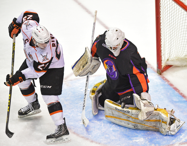 YOUNGSTOWN, OHIO - APRIL 1, 2016: Goalie Ryan Bednard #35 of the Phantoms makes a save while Nick Rivera #23 of Omaha attempts to make a play on the rebound during the 1st period of Friday nights game at the Covelli Centre. DAVID DERMER | THE VINDICATOR