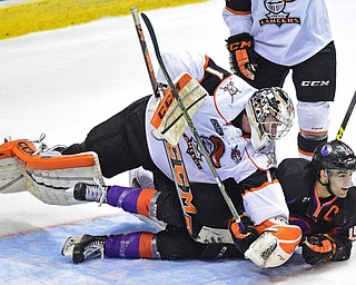 YOUNGSTOWN, OHIO - APRIL 1, 2016: Goalie Zacharias Skog #1 of Omaha takes a swing at Matt Alvaro #19 of the Phantoms after he was tripped and slid into him on a break away during the 1st period of Friday nights game at the Corelli Centre. DAVID DERMER | THE VINDICATOR
