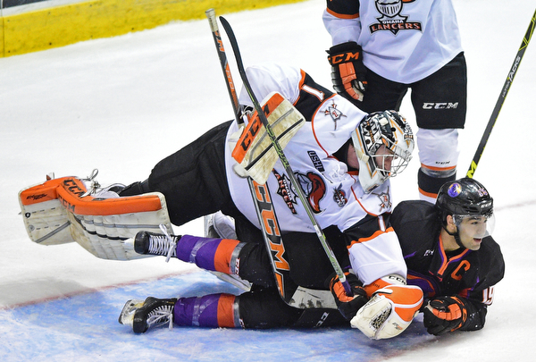 YOUNGSTOWN, OHIO - APRIL 1, 2016: Goalie Zacharias Skog #1 of Omaha takes a swing at Matt Alvaro #19 of the Phantoms after he was tripped and slid into him on a break away during the 1st period of Friday nights game at the Covelli Centre. DAVID DERMER | THE VINDICATOR