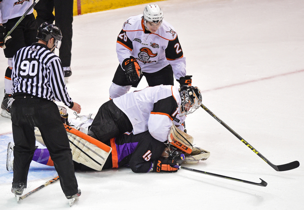 YOUNGSTOWN, OHIO - APRIL 1, 2016: Goalie Zacharias Skog #1 of Omaha takes a swing at Matt Alvaro #19 of the Phantoms after he was tripped and slid into him on a break away during the 1st period of Friday nights game at the Covelli Centre. DAVID DERMER | THE VINDICATOR..Nathan Krusko #26 of Omaha pictured.