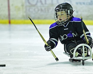 BOARDMAN, OHIO - APRIL 2, 2016: Kellan Shipman #90 of the Youngstown Boom moves the puck up ice during a Adaptive Sled Ice Hockey charity game against the Youngstown Phantoms Bantam A Team Saturday afternoon at the Ice Zone. DAVID DERMER | THE VINDICATOR