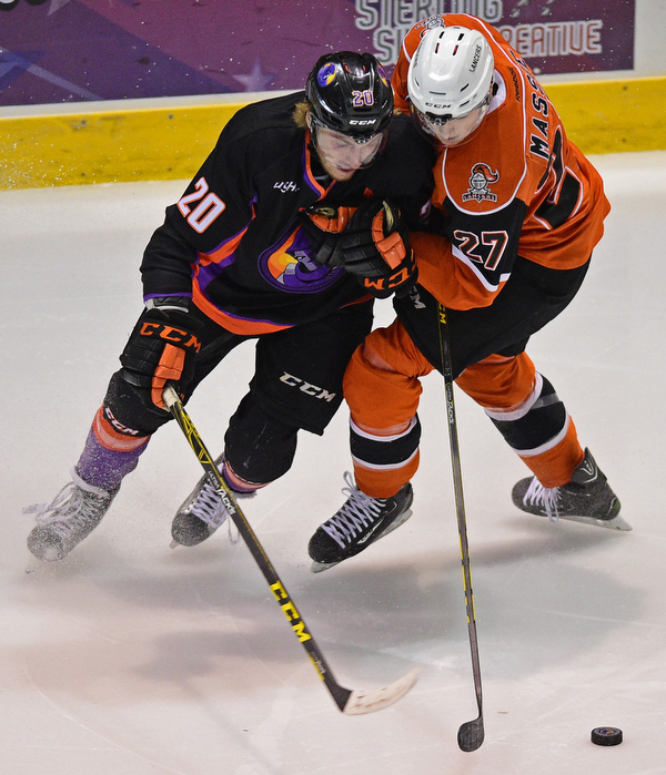 YOUNGSTOWN, OHIO - APRIL 2, 2016: Lukas Craggs #20 of the Phantoms and Jake Massie #27 of the Lancers battle for control of the puck in the neutral zone during the 1st period of Saturday nights game at the Corelli Centre. DAVID DERMER | THE VINDICATOR