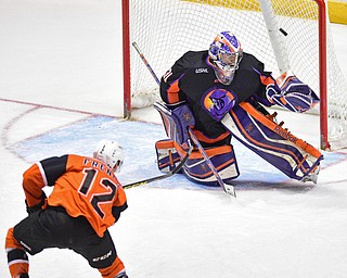 YOUNGSTOWN, OHIO - APRIL 2, 2016: Goalie Colin DeAugustine #31 of the Phantoms deflects the shot from Josh French #12 of the Lancers during the 1st period of Saturday nights game at the Corelli Centre. DAVID DERMER | THE VINDICATOR.