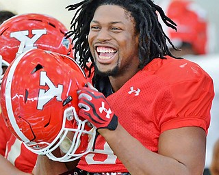 Jeff Lange | The Vindicator  SAT, APRIL 2, 2016 - YSU Defensive end Avery Moss enjoys a moment of laughter during warmups at Saturday's practice at the Watson and Tressel Training Site in Youngstown.
