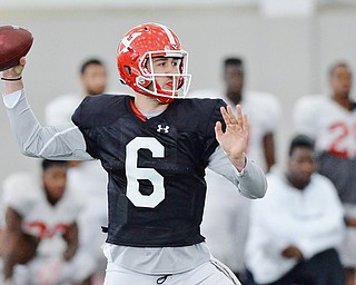 Jeff Lange | The Vindicator  SAT, APRIL 2, 2016 - YSU quarterback Hunter Wells looks downfield to pass during practice in Youngstown Saturday morning.