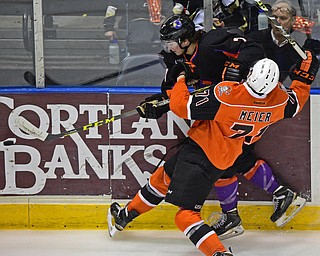 YOUNGSTOWN, OHIO - APRIL 2, 2016: Eric Esposito #7 of the Phantoms is checks into the boards by Matthew Meier #71 of the Lancers during the 1st period of Saturday nights game at the  Covelli Centre. DAVID DERMER | THE VINDICATOR