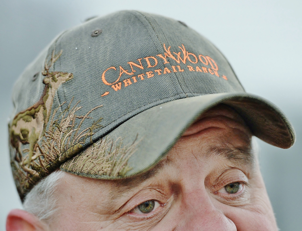 Jeff Lange | The Vindicator  MON, APRIL 4, 2016 - Mark Thompson of West Middlesex wears a Candywood Whitetail Ranch hat in support of it's opening during a protest Monday evening in Vienna.