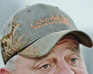 Jeff Lange | The Vindicator  MON, APRIL 4, 2016 - Mark Thompson of West Middlesex wears a Candywood Whitetail Ranch hat in support of it's opening during a protest Monday evening in Vienna.