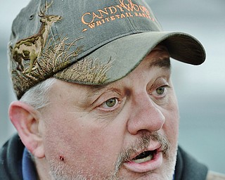 Jeff Lange | The Vindicator  MON, APRIL 4, 2016 - Mark Thompson of West Middlesex wears a Candywood Whitetail Ranch hat in support of it's opening during a protest Monday evening in Vienna.