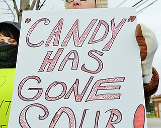 Jeff Lange | The Vindicator  MON, APRIL 4, 2016 - Cheryl Finta of Liberty holds a sign during a protest against the opening of Candywood Whitetail Ranch in Vienna Monday evening.