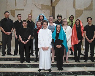 SPECIAL TO THE VINDICATOR | Junior high students at St. Patrick School of Hubbard recently presented a production of the Passion Play, which explored the trial, suffering and death of Jesus Christ. The Lenten activity was staged in the church for families, friends, parishioners and classmates of the students. Participants included, in front from left, Jeremey Hodge and Katie Cigolle; second row, Cade Ross, Kelly Dovellos, Lauren Ladd, Audra Chumley, Keila Cortes and Lucas Mendez; and in back, the Rev. Mike Swierz, Cooper Muccio, Simon Yesh, Kamryn Ross, Elizabeth Chrobak and Isis Rivera.