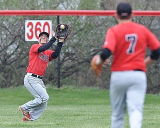 Jeff Lange | The Vindicator  WED, APRIL 6, 2016 - Canfield center fielder Matt Pappas catches a fly ball in the fourth inning against Austintown Fitch Wednesday afternoon in Canfield.
