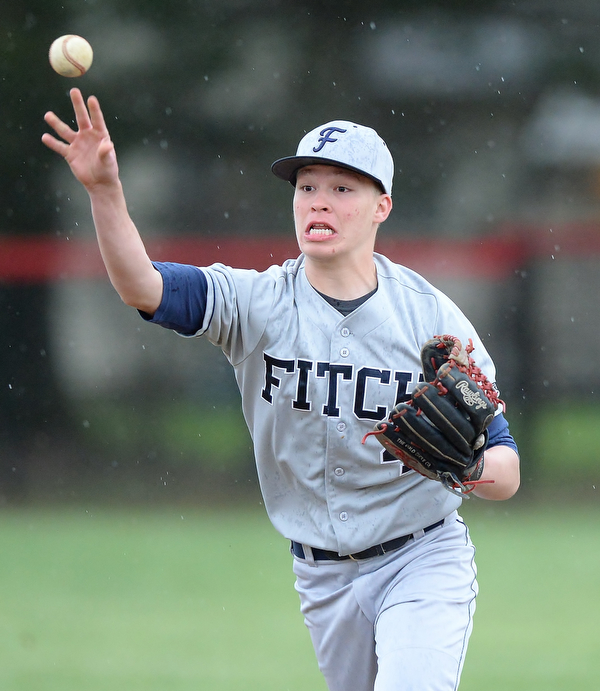 Jeff Lange | The Vindicator  WED, APRIL 6, 2016 - Fitch second baseman Kole Klasic makes a toss to first to put out a Canfield batter in the fourth inning of Wednesday's game at Canfield High School.