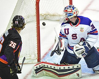YOUNGSTOWN, OHIO - APRIL 9, 2016: Cameron Morrison #26 of the Phantoms and Adam Scheel #31 of Team USA look at the puck in the net after Morrison scored the second phantoms goal of the game during the first period of Saturday nights game at the Corelli Centre. DAVID DERMER | THE VINDICATOR