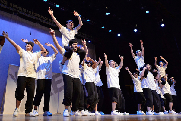 Jeff Lange | The Vindicator  SAT, APRIL 9, 2016 - Members of Youngstown's Sigma Alpha Epsilon perform "Hit 'Em High" by Busta Rhymes during Saturday's The 90s Greeksing event held at Stambaugh Auditorium in Youngstown.