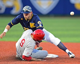 KENT, OHIO - APRIL 13, 2016: Dom Iero #20 of Kent State misplays the throw allowing the baseball to go into center field while base runner Lorenzo Arcuri #9 of YSU to steal second base in the top of the 7th inning during Wednesday nights game at Schooner Stadium. DAVID DERMER | THE VINDICATOR
