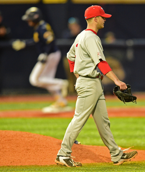 KENT, OHIO - APRIL 13, 2016: Pitcher Joel Hake #3 of YSU shows his frustration after allowing a two run home hun to Zarley Zalewski #9 of Kent State in the bottom of the 7th inning during Wednesday nights game at Schooner Stadium. DAVID DERMER | THE VINDICATOR
