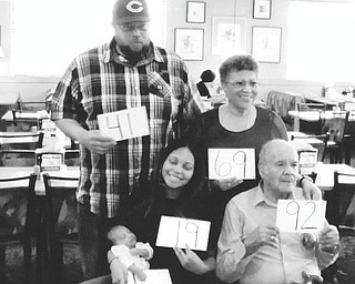 SPECIAL TO THE VINDICATOR | The family of Jack B. Robinson Sr. recently honored him at a celebration of his 92nd birthday. Part of the festivities included a five-generation photo above. Pictured holding signs denoting their ages are Robinson, 92; his daughter, Genevieve Taylor, 69; his grandson, Eric Taylor, 41; his great-granddaughter, Erica Taylor, 19; and his great-great-grandson, Armani Taylor-Barnes, 1 month.