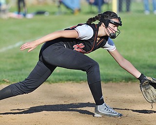 Jeff Lange | The Vindicator  THU, APRIL 14, 2016 - Howland third baseman Kamryn Buckley stretches out in attempt to scoop up a ground ball late in Thursday's game against Boardman at Howland Township Park.