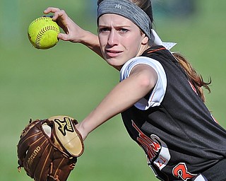 Jeff Lange | The Vindicator  THU, APRIL 14, 2016 - Howland second baseman Emily Darlington looks to make a throw to first as she drops the ball during Thursday's game against Boardman at Howland Township Park.
