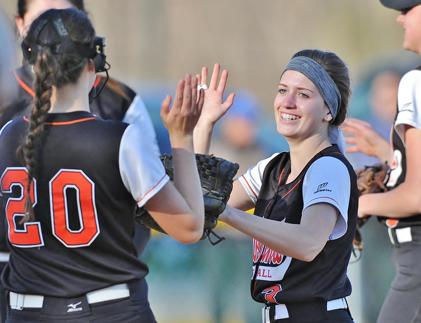 Jeff Lange | The Vindicator  THU, APRIL 14, 2016 - Howland second baseman Emily Darlington (right) celebrates a double play late in Thursday's game against Boardman at Howland Township Park.