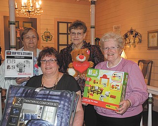 SPECIAL TO THE VINDICATOR
Preparing for the upcoming basket auction sponsored by the Mill Creek Chapter of the American Business Women's Association are, from left, Shirley Pappagallo, vice president; Mary Brown; Jackie Fischer, chairwoman of the education committee; and Judy Codespote, chapter president.