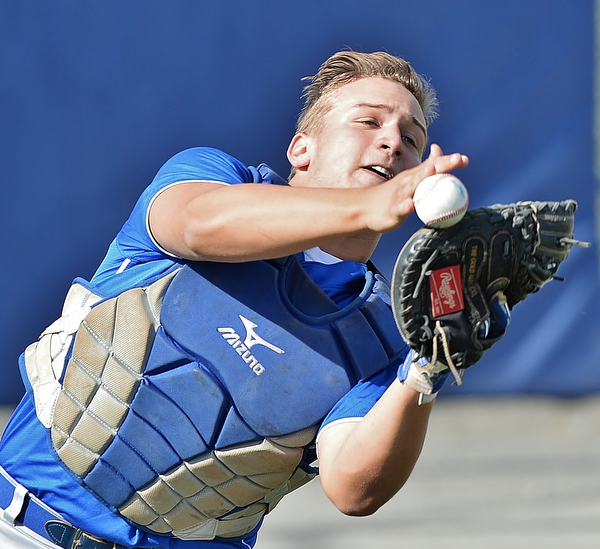 Jeff Lange | The Vindicator  MONDAY, APRIL 18, 2016 - Poland catcher Nick Petrol attempts to catch a foul ball in the first inning of Monday's game against Austintown Fitch at Poland High School. The Bulldogs downed the Falcons 13-1.