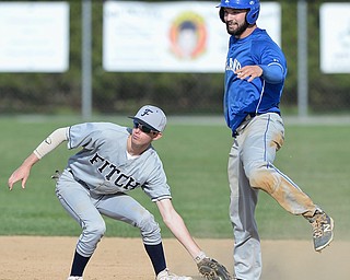 Jeff Lange | The Vindicator  MONDAY, APRIL 18, 2016 - Austintown shortstop Jack Gherardi (11) and Poland's Anthony Calcagni look to the official for the call after Gherardi tagged Calcagni out during Monday's game in Poland.
