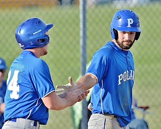 Jeff Lange | The Vindicator  MONDAY, APRIL 18, 2016 - Poland's Anthony Calcagni (right) celebrates a run with teammate Dan Klase in the fourth inning of Monday's game against Fitch at Poland High School.
