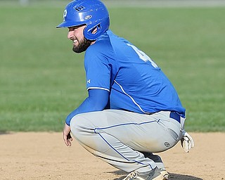 Jeff Lange | The Vindicator  MONDAY, APRIL 18, 2016 - Poland's Anthony Calcagni crouches on second during an Austintown timeout in the fourth inning of Monday's game at Poland High School.