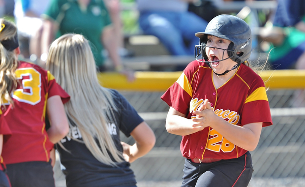 Jeff Lange | The Vindicator  WED, APRIL 20, 2016 - Mooney's Conchetta Rinaldi (right) celebrates as she is met at the plate by teammates after hitting a three-run homer to center field in the first inning of Cardinal Mooney's softball game against Ursuline High School at Fields of Dreams Park in Boardman Wednesday afternoon.