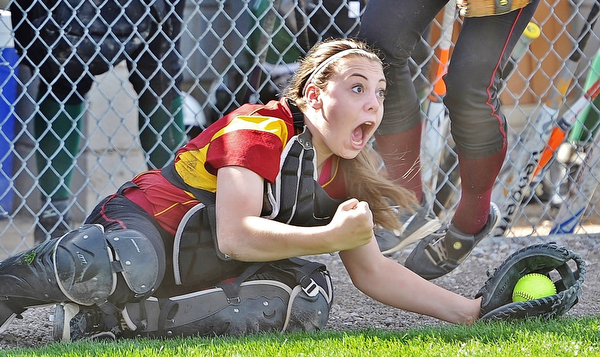 Jeff Lange | The Vindicator  WED, APRIL 20, 2016 - Cardinal Mooney catcher Conchetta Rinaldi celebrates after making a diving catch to end the top of the second inning during Wednesday's softball game against Ursuline at Fields of Dreams Park in Boardman.