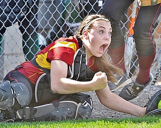 Jeff Lange | The Vindicator  WED, APRIL 20, 2016 - Cardinal Mooney catcher Conchetta Rinaldi celebrates after making a diving catch to end the top of the second inning during Wednesday's softball game against Ursuline at Fields of Dreams Park in Boardman.