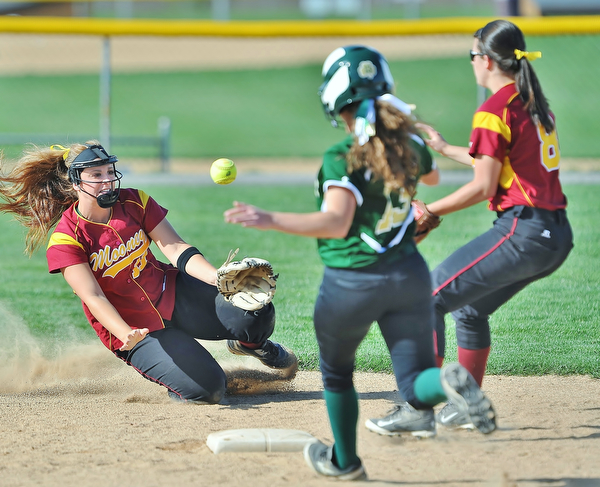 Jeff Lange | The Vindicator  WED, APRIL 20, 2016 - Cardinal Mooney shortstop Jami Difabio (left) makes a toss to second baseman Bridget Sweeney (8) in attempt to out Ursuline baserunner Madison Kelly in the third inning of Wednesday's softball game at Fields of Dreams Park in Boardman.