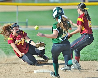 Jeff Lange | The Vindicator  WED, APRIL 20, 2016 - Cardinal Mooney shortstop Jami Difabio (left) makes a toss to second baseman Bridget Sweeney (8) in attempt to out Ursuline baserunner Madison Kelly in the third inning of Wednesday's softball game at Fields of Dreams Park in Boardman.