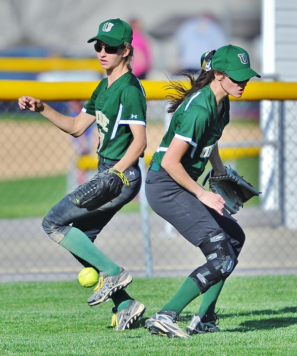 Jeff Lange | The Vindicator  WED, APRIL 20, 2016 - Left fielder Lorraine Fitzgerald (right) and center fielder Caroline Aey (left) have trouble fielding a ball hit to left center field in the fifth inning of Wednesday's game in Boardman.
