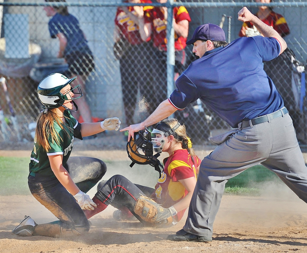 Jeff Lange | The Vindicator  WED, APRIL 20, 2016 - Ursuline baserunner Megan Ross (left) looks up at the official in disbelief as he calls her out at the plate after Mooney's Sydney Kocher tagged her out in the fifth inning of Wednesday's game in Boardman.