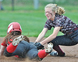 Jeff Lange | The Vindicator  THU, APRIL 21, 2016 - South Range shortstop Codi Taylor (right) puts the tag on Clippers' baserunner Kennedy Fullum as she dives to second base in the second inning of Thursday afternoon's game at South Range High School. South Range edged Columbiana 1-0.