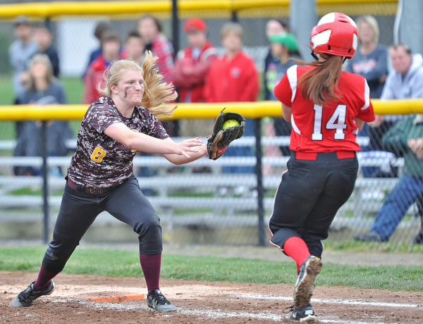 Jeff Lange | The Vindicator  THU, APRIL 21, 2016 - South Range first baseman Madison Weaver (8) looks to apply the tag to Columbiana batter Gillian Stilson (14) in the fifth inning of their matchup at South Range High School Thursday.