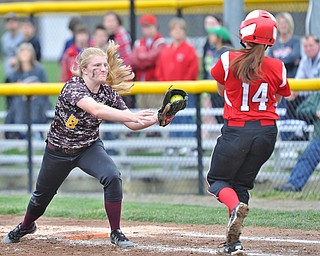Jeff Lange | The Vindicator  THU, APRIL 21, 2016 - South Range first baseman Madison Weaver (8) looks to apply the tag to Columbiana batter Gillian Stilson (14) in the fifth inning of their matchup at South Range High School Thursday.