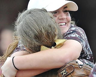 Jeff Lange | The Vindicator  THU, APRIL 21, 2016 - Winning pitcher Caragyn Yanek (top) embraces teammate Morgan Smith after the Raiders' 1-0 victory over Columbiana Thursday at South Range High School.