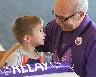 William D Lewis the Vindicator Louie Muche,68, a cancer survivor for 32 years shares a moment with his grandson Louie Muche, 4, during YSU Relay for Life 4-15-16. They are from McDonald.