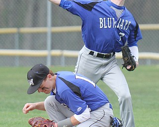 William d Lewis The vindicator  JM's Eric Ostrowski(7) throws to first as Branden Nagy(13) ducks. Out at first is SR's Anthony Ritter(9) during 1rst inning of 4-22 game.